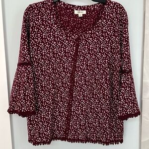 Size M embroidery trimmed blouse with flare sleeves.